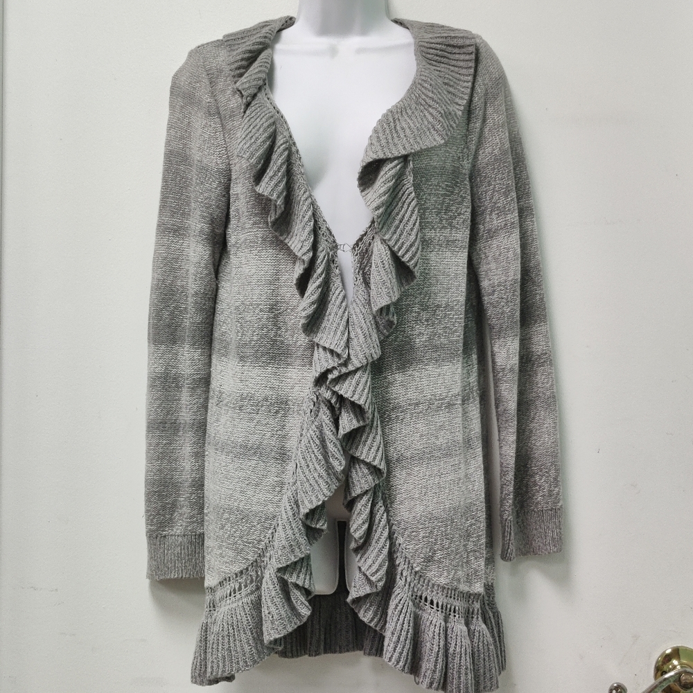 Open cardigan with ruffle detail.